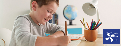 Image of a child is concentrating on his studies.