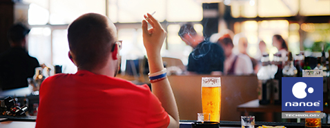 The picture of a man smoking in the dining area.