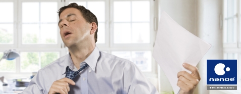 Image of a frustrated man taking off his necktie.
