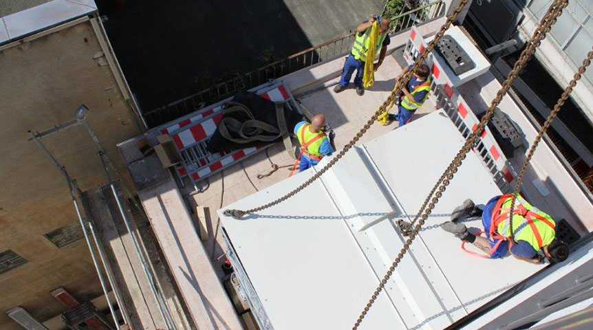 An image of construction workers installing system in Bochum university