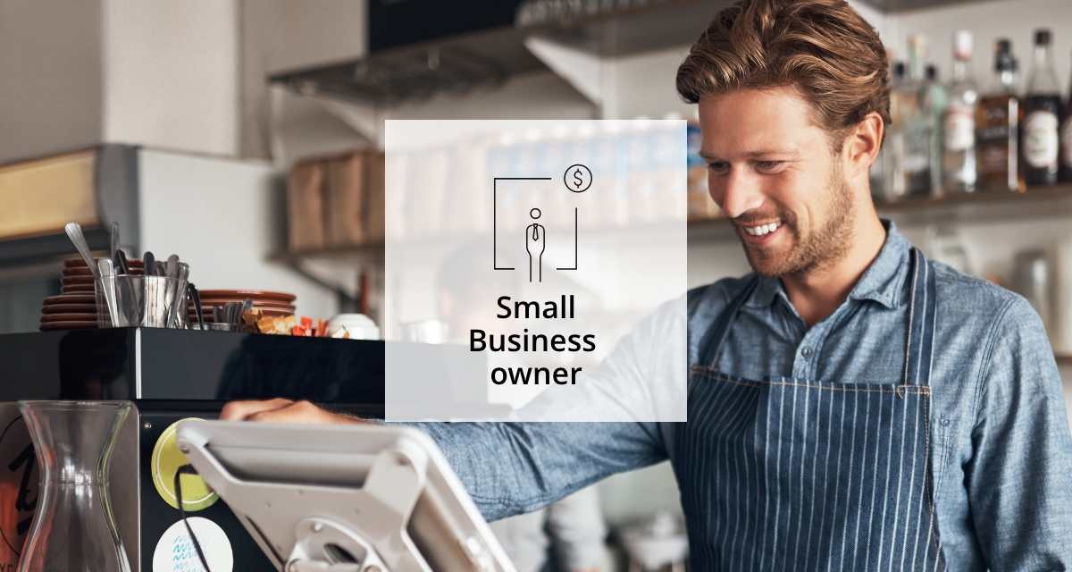 An image of a man using a cash register as a Business Owner