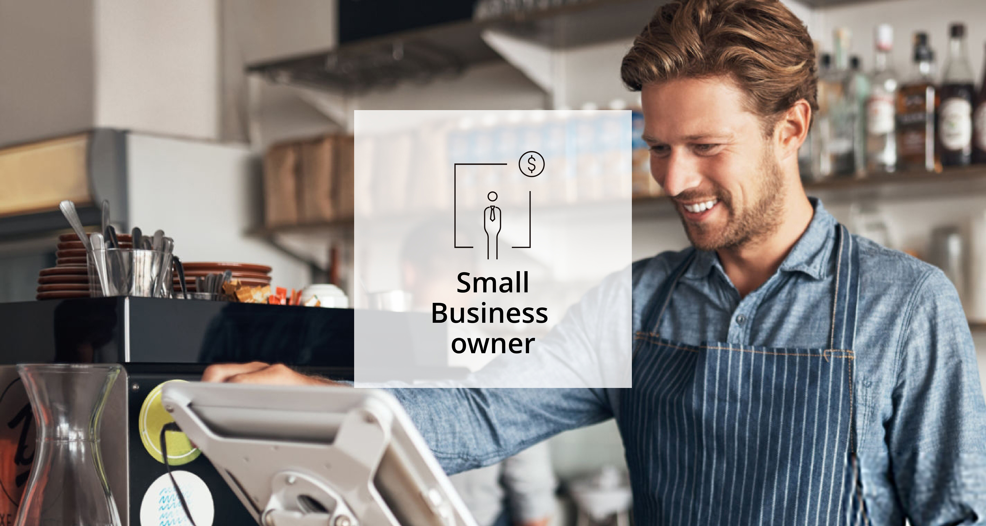 An image of a man using a cash register as a Business Owner