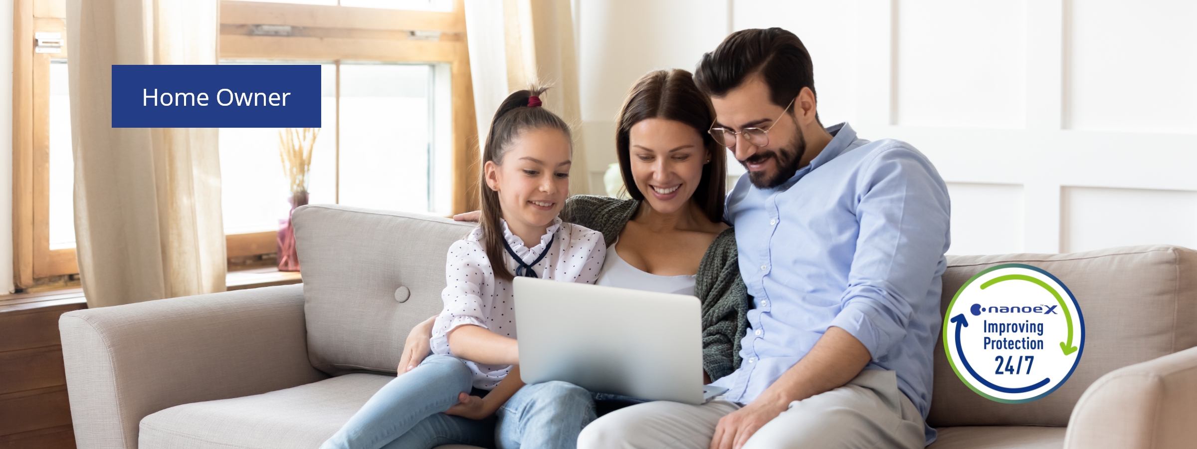 An image of a daughter and her parents sitting on a sofa while looking into a PC.