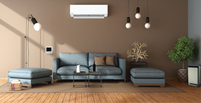 Living room with sofa and Panasonic air conditioner and Panasonic air purifier and also Panasonic Indoor Air Quality controller and sensor.