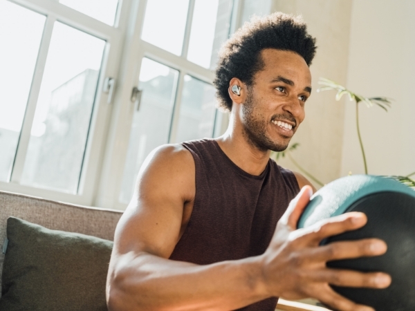 Male working out wearing earphones