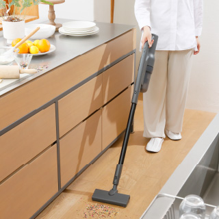 Child with a vacuum cleaner