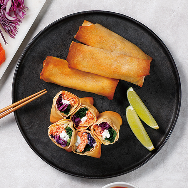 Healthy fried spring rolls filled with salmon See more