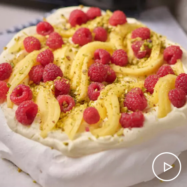 Pavlova with Mango & Raspberries See more