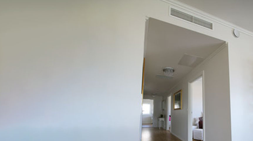 An image of a Panasonic slim ducted product installed in a room