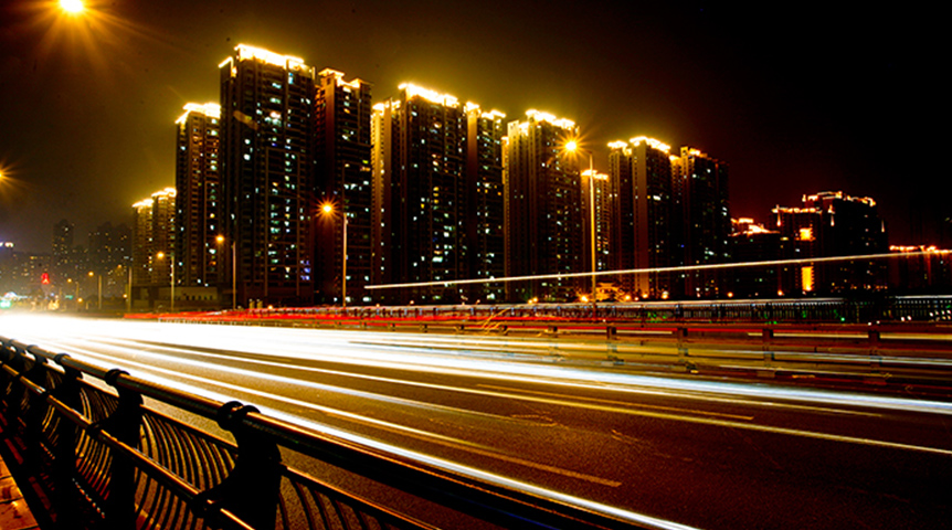 An image of Star River Group luxury condominium building lightened up during nighttime