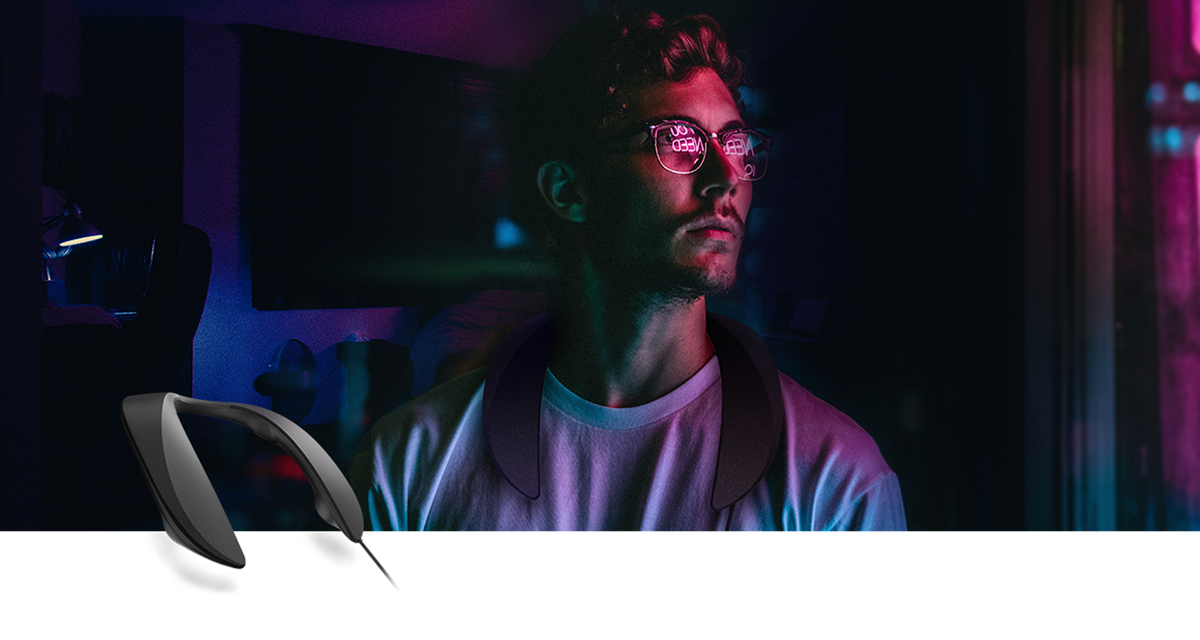 A young man wears the new SC-GN01 portable gaming spaker around his neck