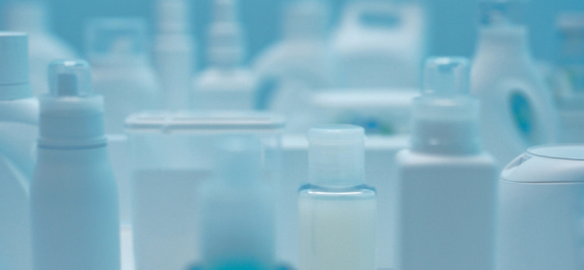 Close-up photo of many types of laundry detergents and fabric softeners in unmarked containers for testing.