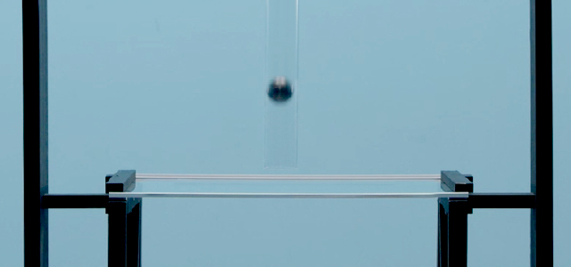 A steel ball being dropped on a refrigerator shelf during testing.