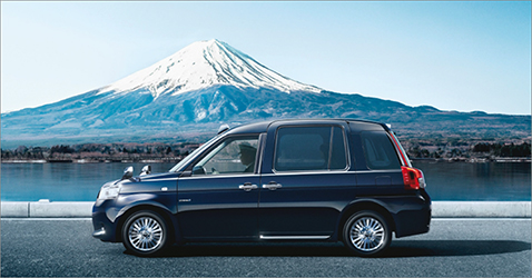 An image of JPN TAXI in front of Mt. Fuji