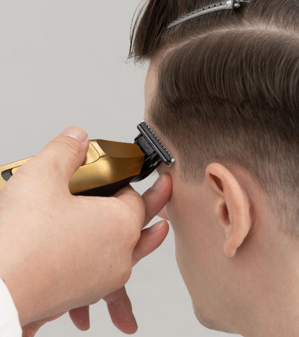 In Use on the Temples with a Hair Trimmer ER-XT70