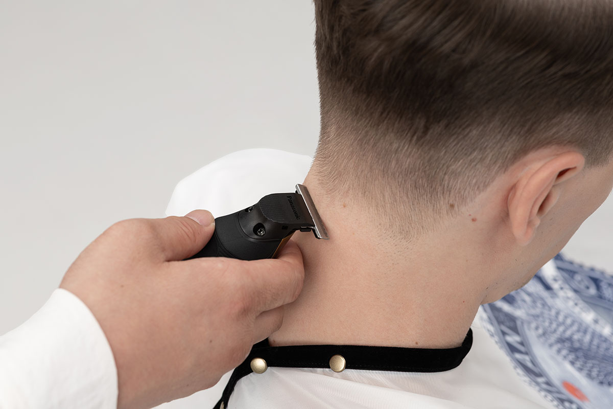 In Use on the Neckline with a Hair Trimmer ER-XT70