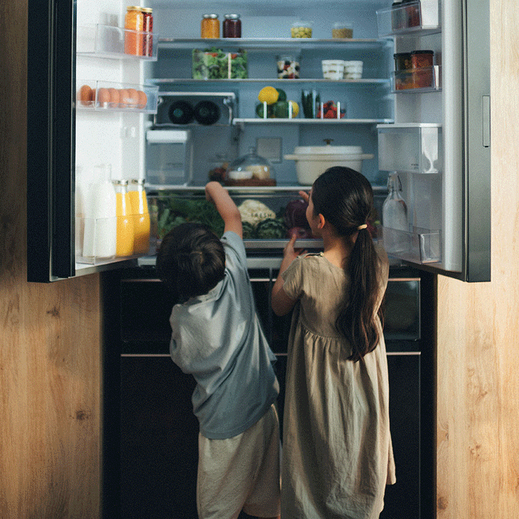 Side-by-side photos: Two young children peering into an open refrigerator, and a tray of freshly baked mini-pizzas being taken out of a combination oven.