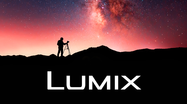 Link Banner: Lumix. Photo of a photographer on a rocky ridge silhouetted against a vibrant night sky.