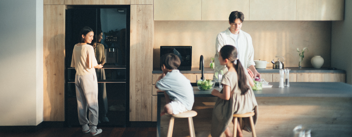 Image of mother, father, daughter and son in the kitchen