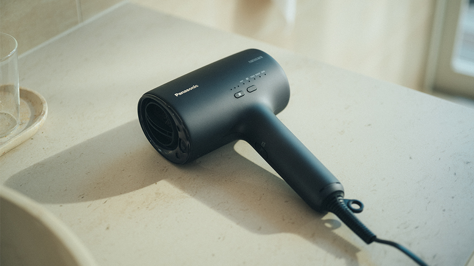 Image of black hair dryer with stylish design