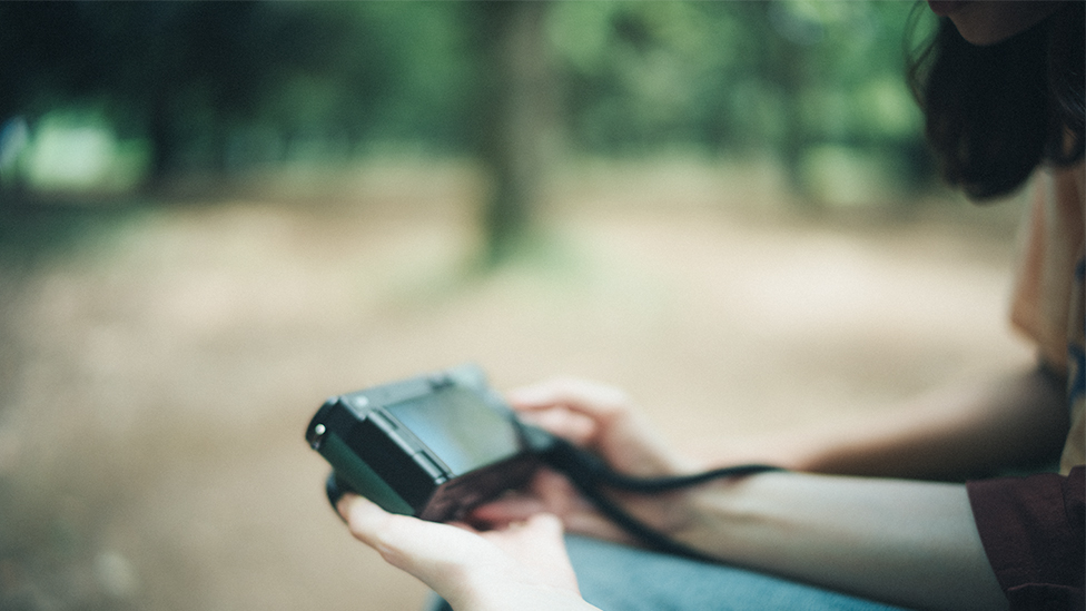 Image of viewing and sharing photos taken on the spot