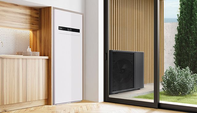 Photo of residential air-to-water heat pump. The indoor unit blends in well with the bright interior space, while the outdoor unit harmonises with the exterior architecture.