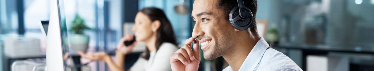 image: An operator consulting over the phone while looking at the screen