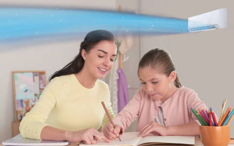 A lady assisting a girl in doing schoolwork with air flow from conditioner flowing on top