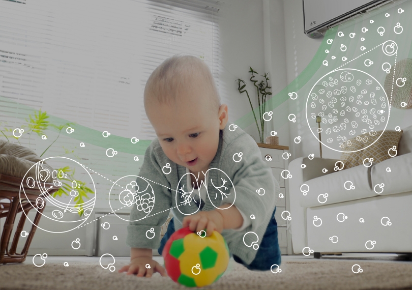 An image of a baby playing on a carpet while nanoe™ X operation