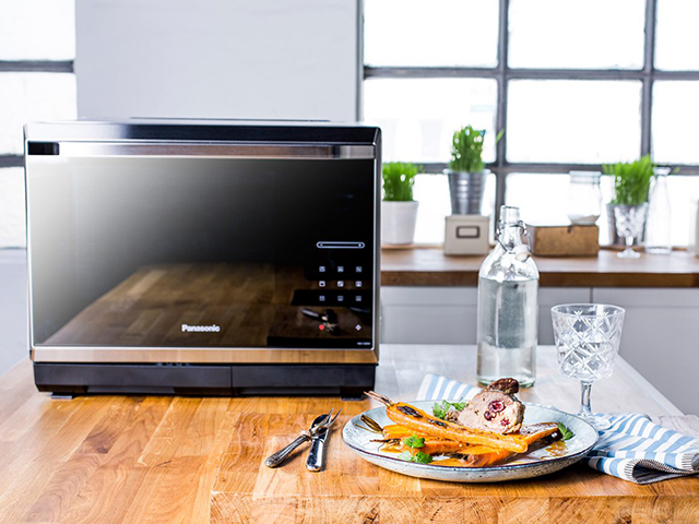 Roast lamb stuffed with lemon-couscous on glazed carrots