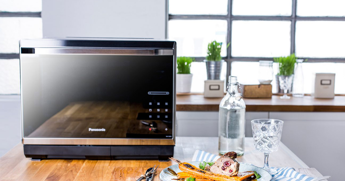 Roast lamb stuffed with lemon-couscous on glazed carrots