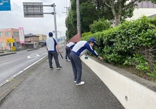 Photo of cleanup activities around the factory, demonstrating community engagement and environmental stewardship efforts by Panasonic.