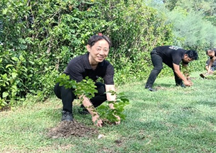 Photo of tree planting activities, highlighting Panasonic’s commitment to biodiversity and environmental conservation through local greening efforts.