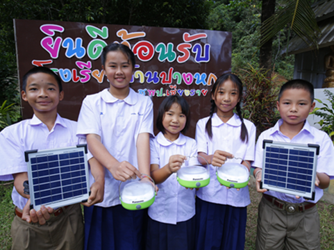Photo of solar lanterns being donated to recipients in need