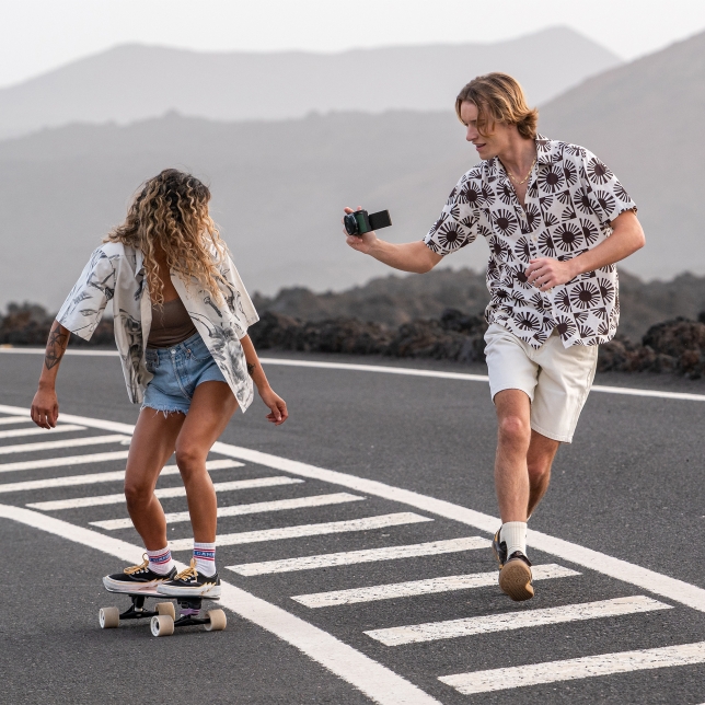 A content creator shooting handheld with the LUMIX S9