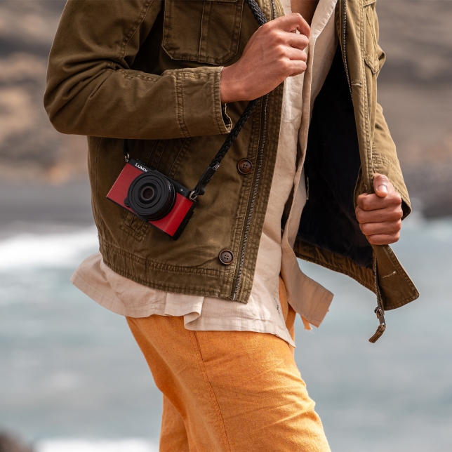 A creator casually carrying the LUMIX S9 fitted with S 26mm F8 lens