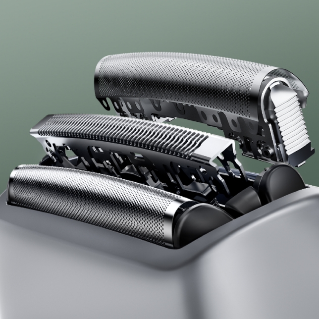 Close-up of three stainless steel shaving blades