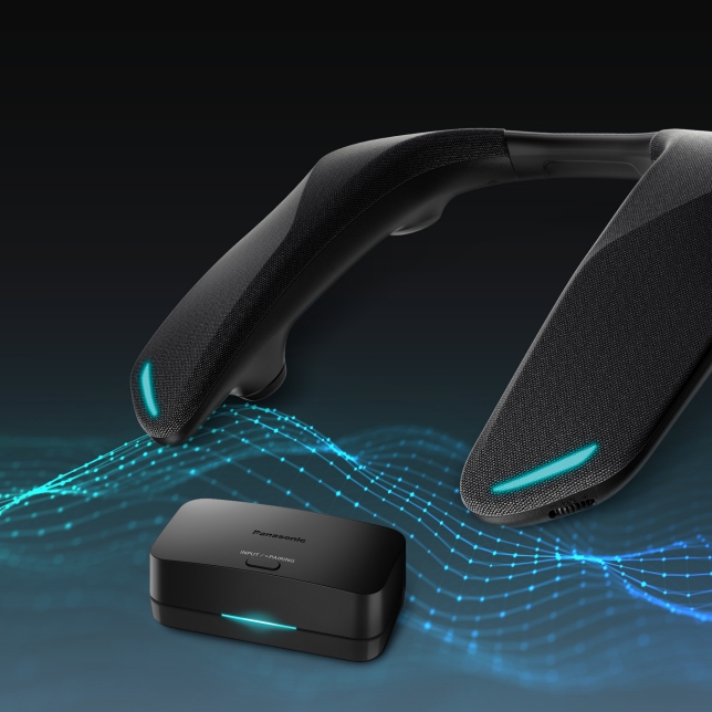 Wearable speaker with blue LED lights, wirelessly connected to the compact transmitter box.