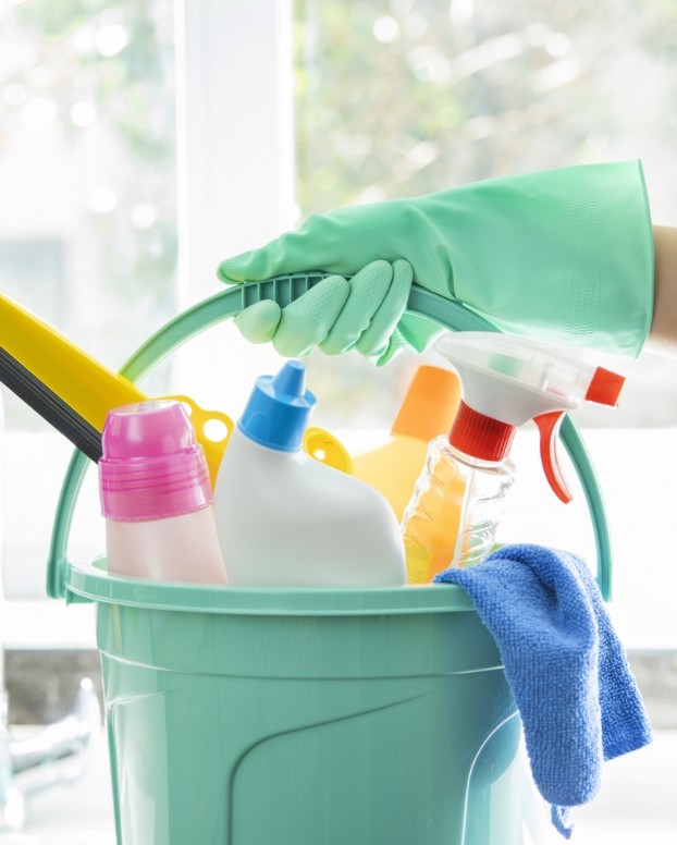 An image of various cleaning tools in a bucket An image of various cleaning tools in a bucket