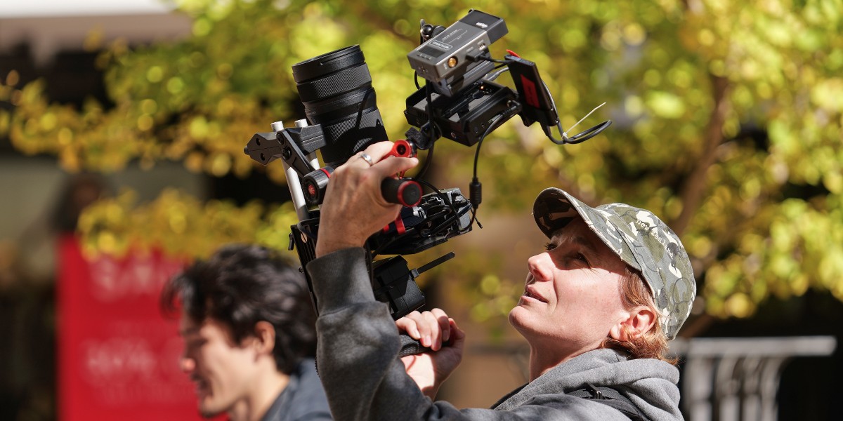 A content creator filming a video with the LUMIX S5IIX